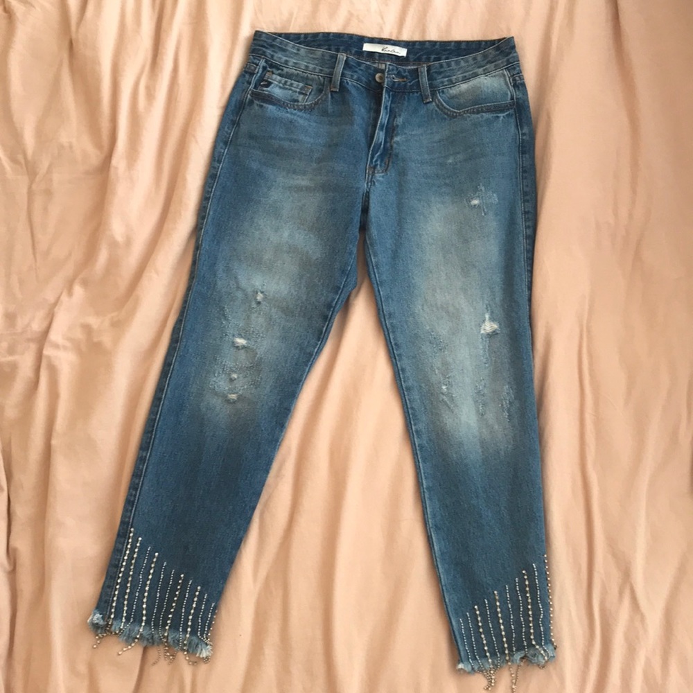 Blue jeans with crystal fringe